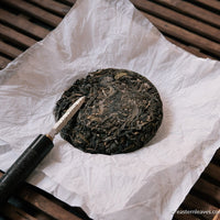 Pu'er shengpu ancient trees gushu in pressed cake, from Yunnan, China. 2021 spring tea