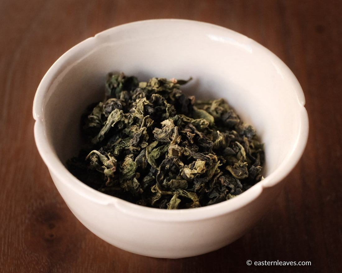 Tieguanyin wulong tea low roasted flowery in glass cup teaware, from China, Fujian, loose leaf premium tea