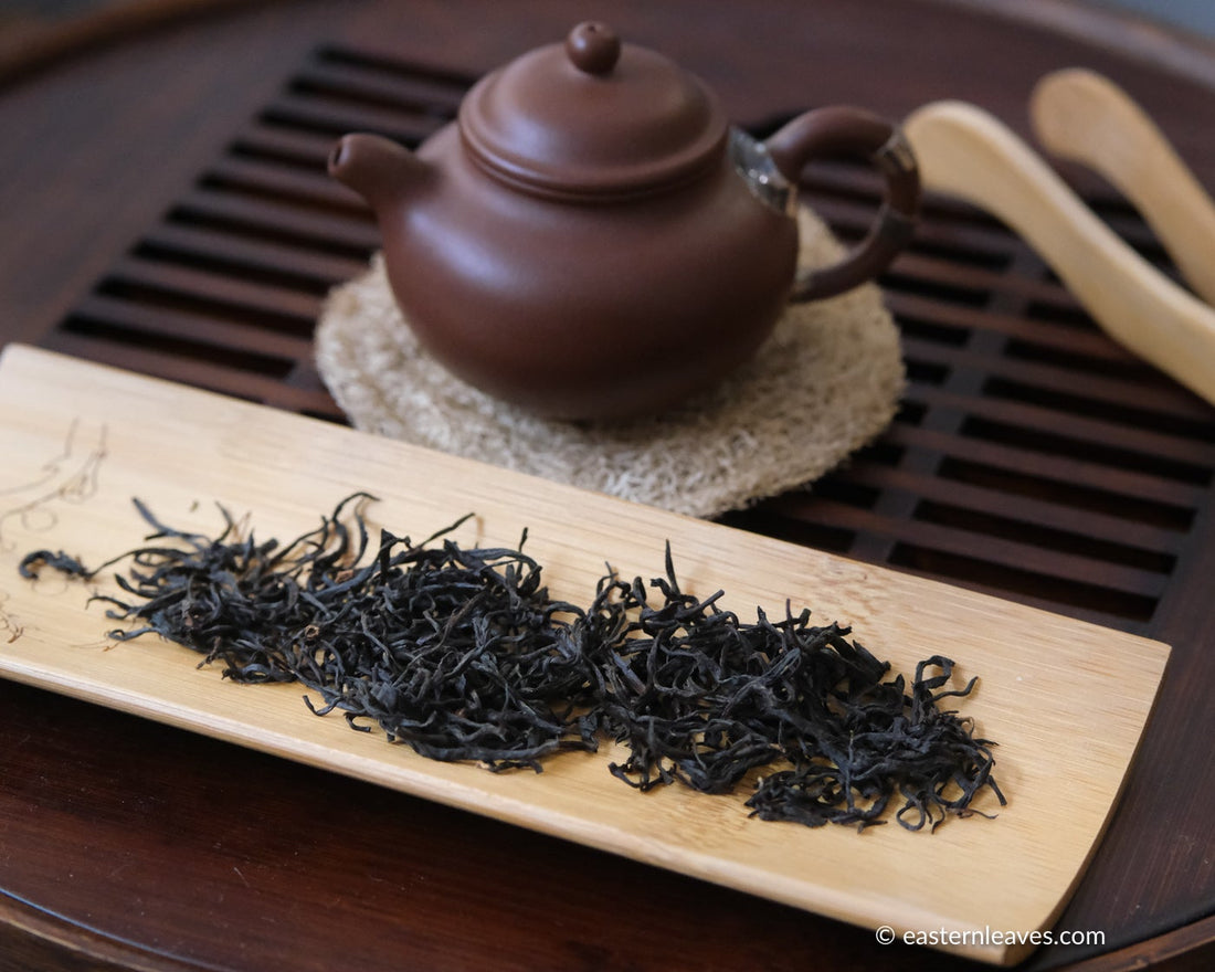 red tea, or black, from Yixing, China, in loose-leaf handcrafted with yixing clay teapot and bamboo tray