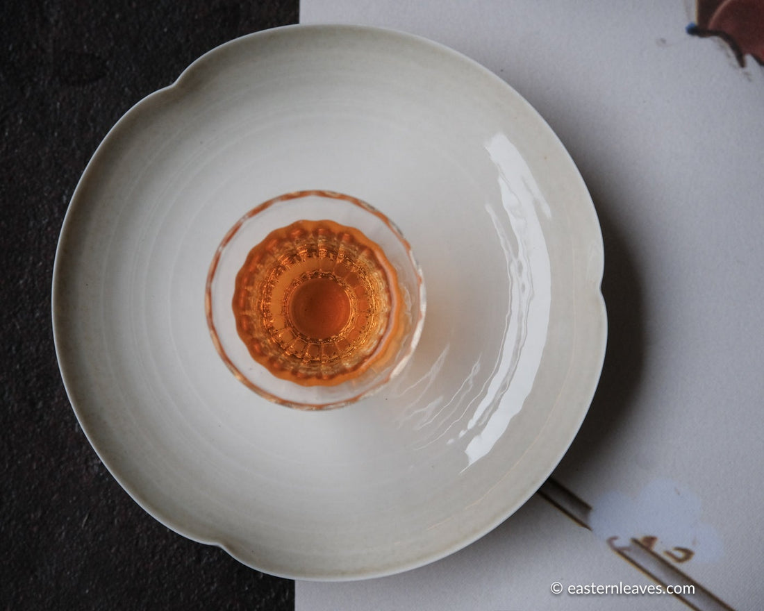 red tea, or black, from Yixing, China, in loose-leaf handcrafted with glass cup and white porcelain tray