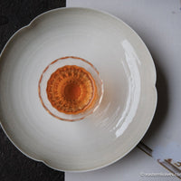red tea, or black, from Yixing, China, in loose-leaf handcrafted with glass cup and white porcelain tray