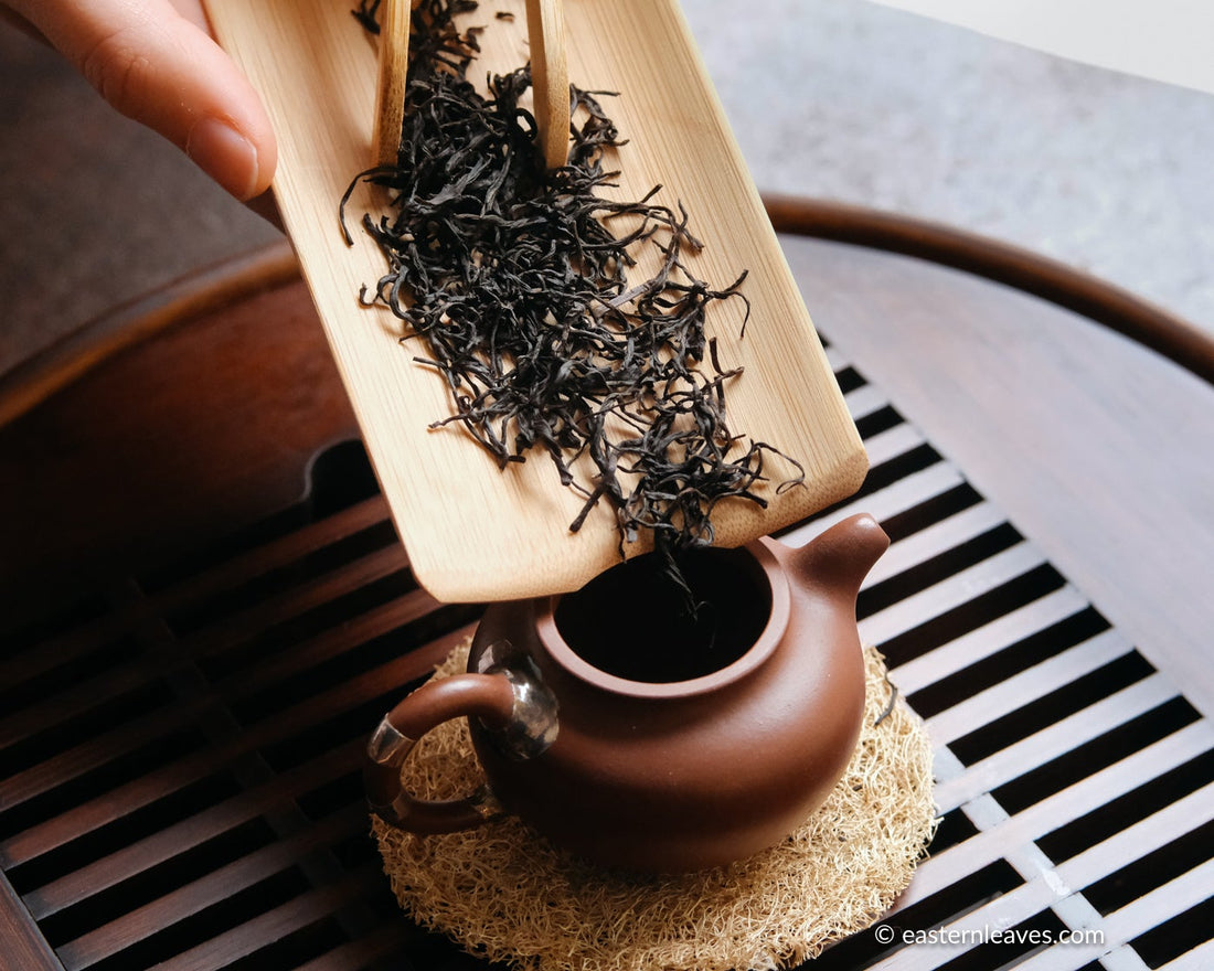 red tea, or black, from Yixing, China, in loose-leaf handcrafted with yixing clay teapot and bamboo tray