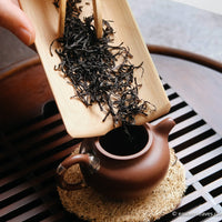 red tea, or black, from Yixing, China, in loose-leaf handcrafted with yixing clay teapot and bamboo tray