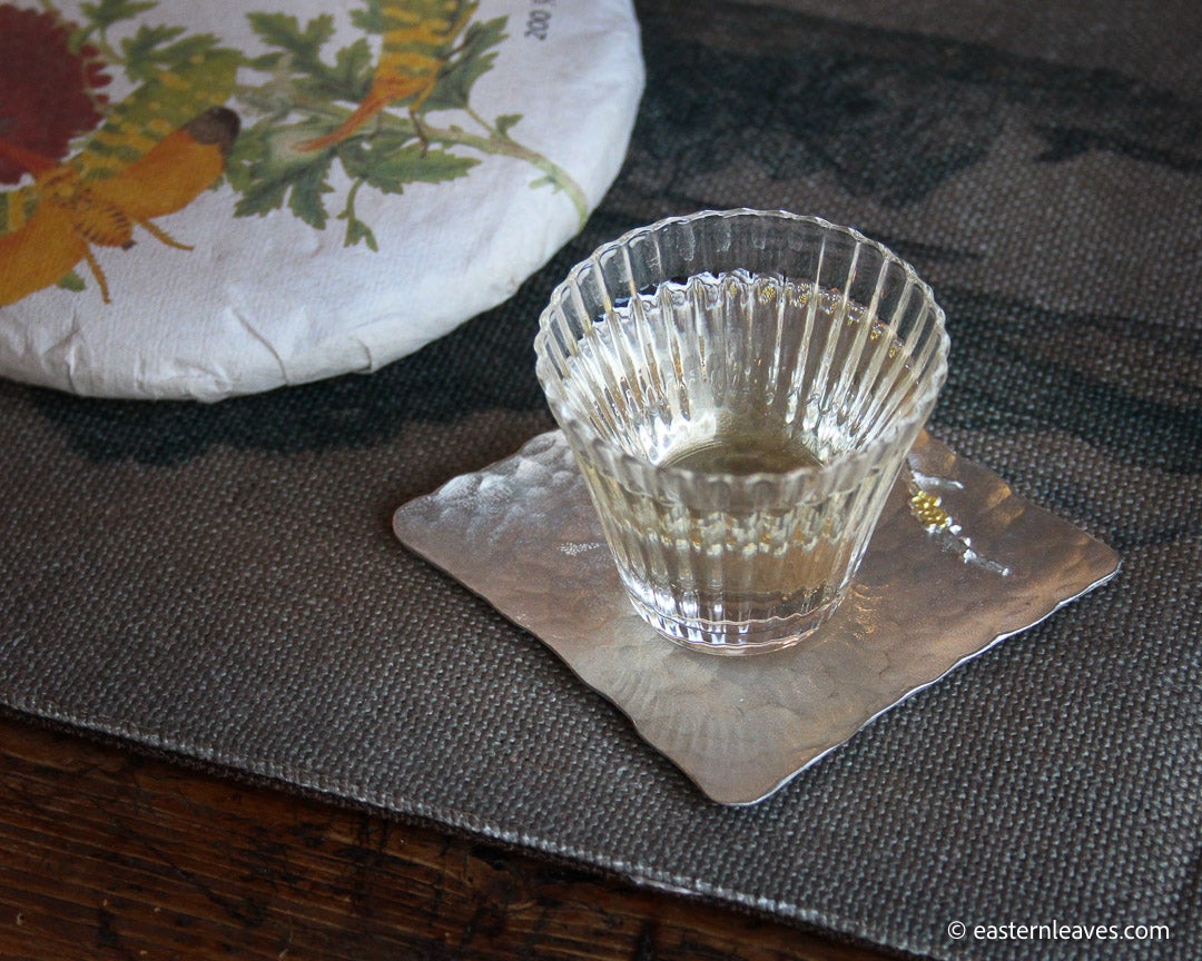 Youle mountain Pu'er shengpu in forest in pressed cake, from Yunnan, China, 2021 spring harvest vintage, sustainable