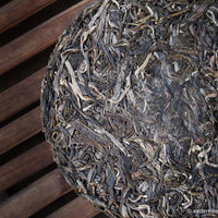 Youle mountain Pu'er shengpu in forest in pressed cake, from Yunnan, China, 2021 spring harvest vintage, sustainable loose-leaf