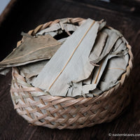 Ancha dark black tea, fermented, in original bamboo leaf basket; 2014 harvest from China