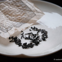 Ancha dark black tea, fermented, in original bamboo leaf basket; 2014 harvest from China loose-leaf