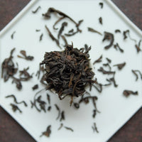 Dahongpao rock tea from Zhenyan premium area, Wuyi, Wuyishan, in China. Loose leaf wulong tea in white cup teaware