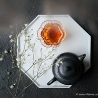 Liubao cha dark black tea, fermented, in original bamboo leaf basket; 2006 harvest from China with black yixing teapot