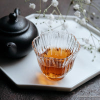 Liubao cha dark black tea, fermented, in original bamboo leaf basket; 2006 harvest from China