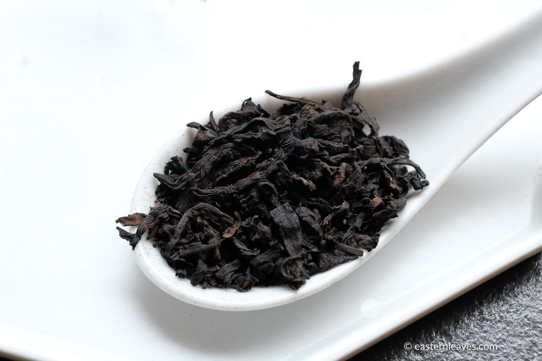 Liubao cha dark black tea, fermented, in original bamboo leaf basket; 2006 harvest from China