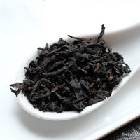 Liubao cha dark black tea, fermented, in original bamboo leaf basket; 2006 harvest from China