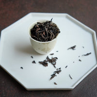 Rougui Zhengyan yancha from Wuyishan in China, Banyan premium area, liquor in loose leaf in cup teaware