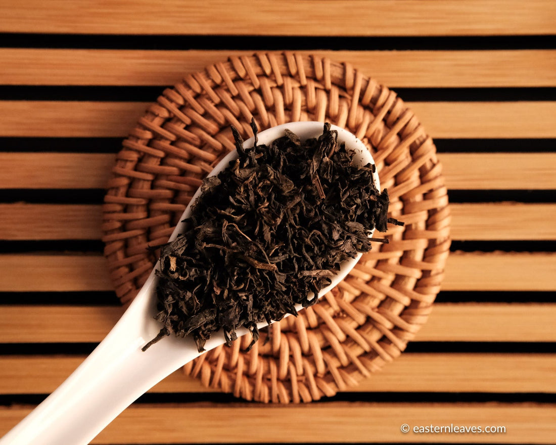 Tianjian cha dark black tea, fermented, in original bamboo leaf basket; 2014 harvest from China
