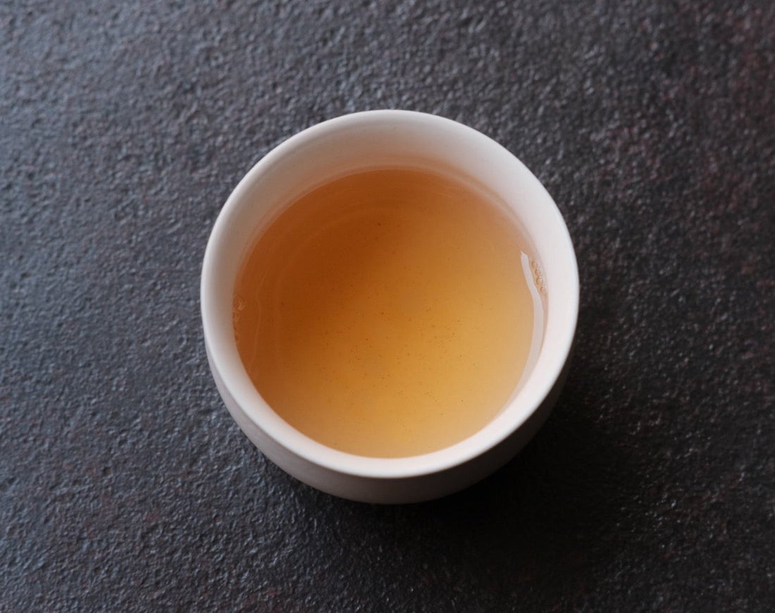 Liquor brew of Pu'er shengpu Chinese tea pressed cake brick vintage and aged, 2012 spring harvest, from Nannuo in Yunnan