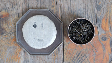 Pu'er shengpu Chinese tea pressed cake brick vintage and aged, 2017 spring harvest, tea forest, golden buds, from Nannuo in Yunnan
