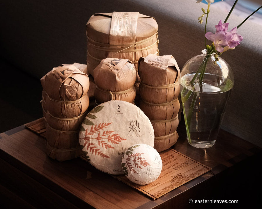 Pu'er shupu from Jingmai, Yunnan, fermented tea, black, in pressed cake, brick, tuocha and bamboo tong