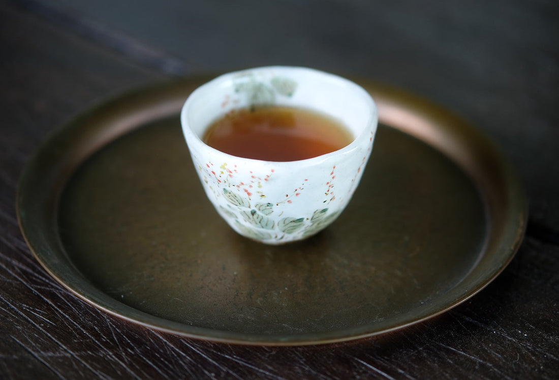 Pu'er shupu dark and fermented tea, from Nannuo Menghai, loose-leaf Chinese tea in ceramic hand painted cup