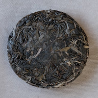 Leaves detail of Nannuo Pu'er shengpu tea Chinese pressed cake brick vintage and aged, 2020 spring harvest, forest tea, from Yunnan