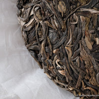 Laobanzhang  pu'er shengpu tea from ancient trees gushu, in Yunnan, China; stone pressed cake high quality tea