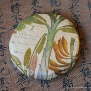 Pu'er shengpu in forest in pressed cake, from Yunnan, China, 2021 spring harvest vintage, sustainable