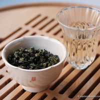 Tieguanyin wulong tea low roasted flowery in glass cup teaware, from China, Fujian, loose leaf premium tea