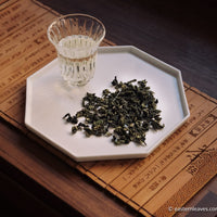 Tieguanyin wulong tea low roasted flowery in glass cup teaware, from China, Fujian, loose leaf premium tea