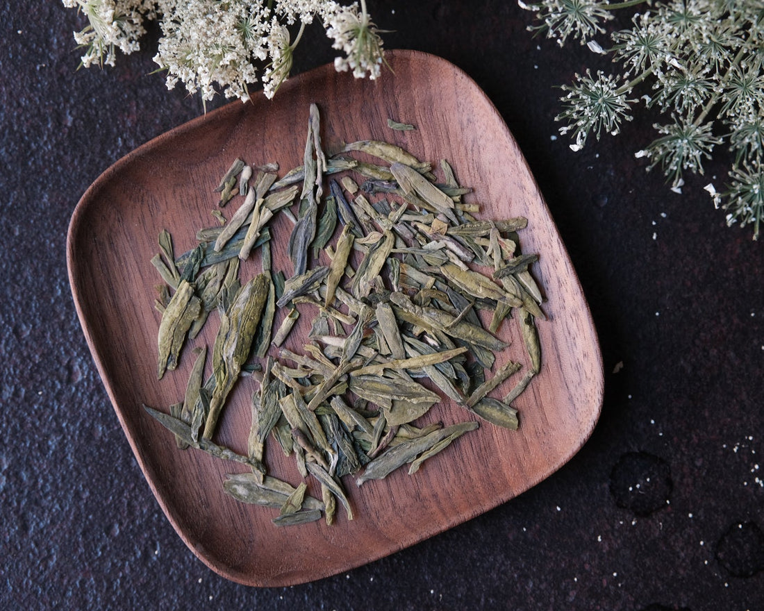 Longjing from Xihu Meijiawu, original cultivar pre-rain, Chinese green tea loose-leaf with white flower