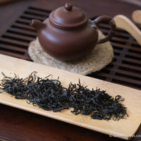 red tea, or black, from Yixing, China, in loose-leaf handcrafted with yixing clay teapot and bamboo tray