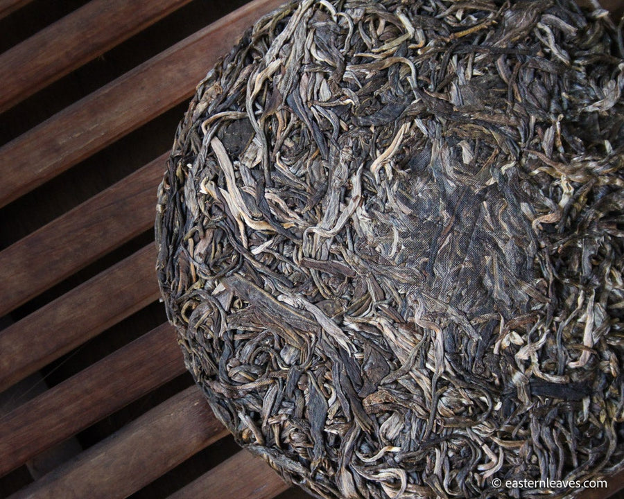 Youle mountain Pu'er shengpu in forest in pressed cake, from Yunnan, China, 2021 spring harvest vintage, sustainable loose-leaf