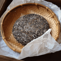 pu'er tea pressed in brick cake from Youle mountain, Yunnan, Xishuangbanna, with loose-leaf detail