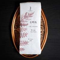 Pu'er shupu dark and fermented tea, from Nannuo Menghai, loose-leaf Chinese tea in paper package