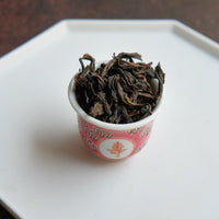 Dahongpao rock tea from Banyan premium area, Wuyi, Wuyishan, in China. Loose leaf wulong tea in antique Chinese cup