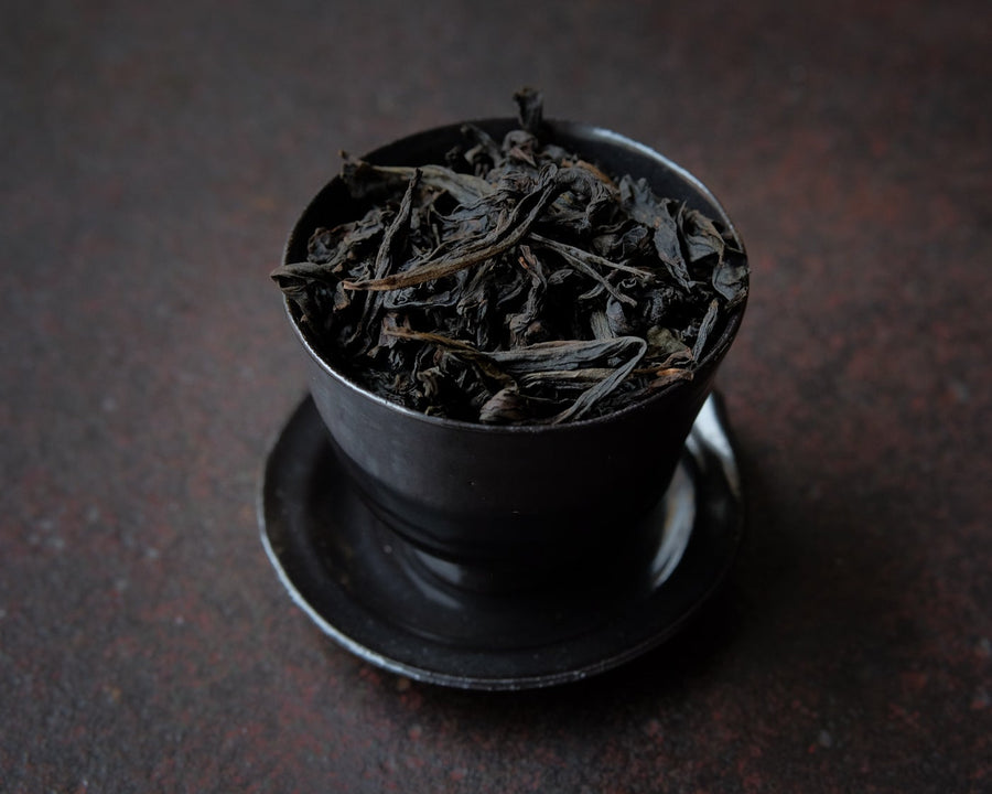 Dahongpao rock tea from Zhenyan premium area, Wuyi, Wuyishan, in China. Loose leaf wulong tea in black cup teaware