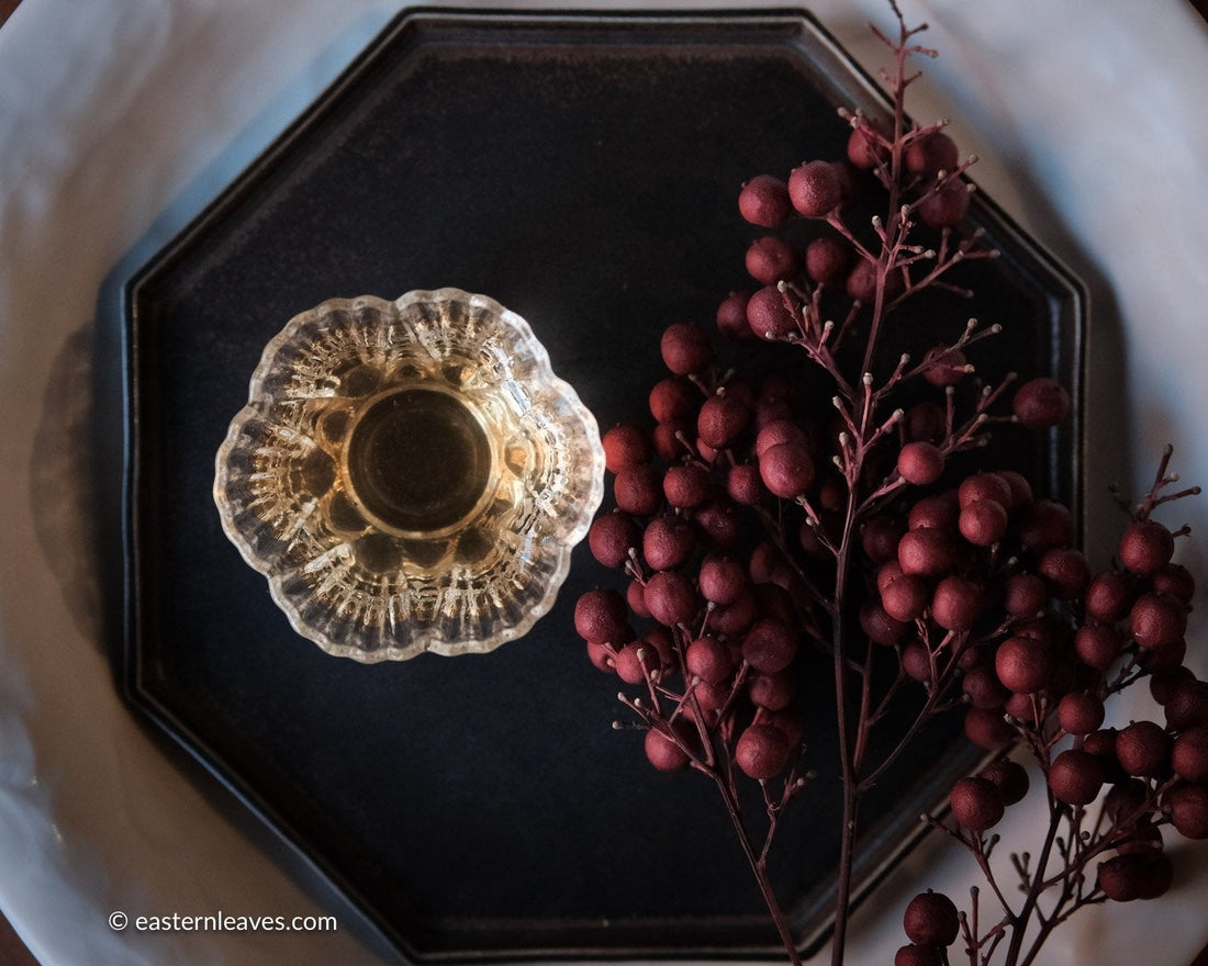 Dancong wulong Chinese tea in loose leaf, gongfucha glass cup in tea table 