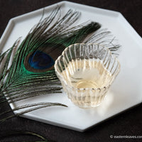 Dancong Yashixiang duck shit fragrance wulong tea from Guangdong China, served in glass cup teaware with peacock leaf