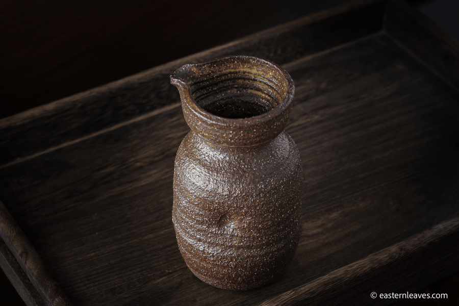 Dai minority Gongdaobei, tea pitcher, handcrafted in Yunnan, China - brown rough texture clay, 250ml, on wood