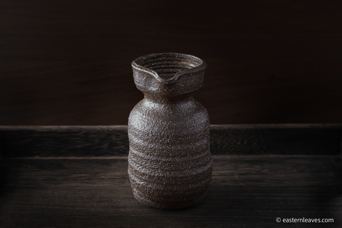 Dai minority Gongdaobei, tea pitcher, handcrafted in Yunnan, China - brown rough texture clay, 250ml, on wood