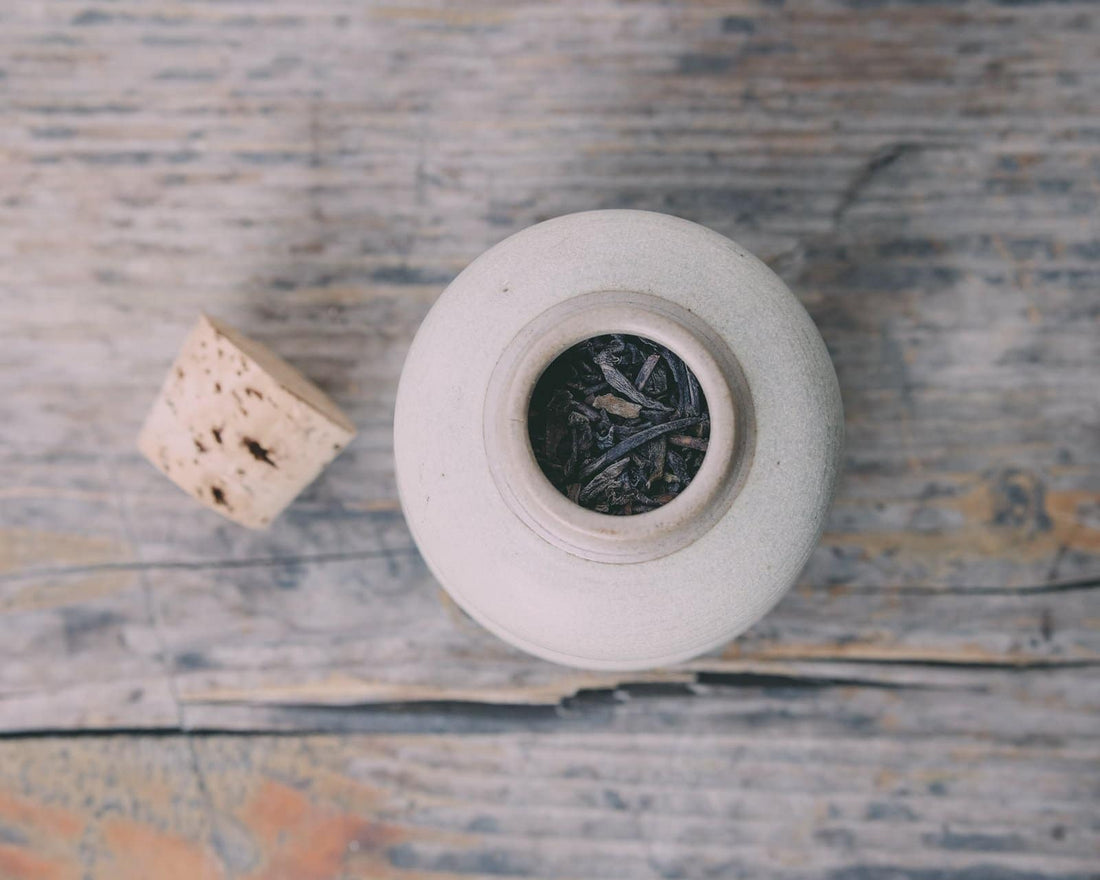 ceramic tea jar with pu'er shupu dark and fermented Chinese tea from Yunnan