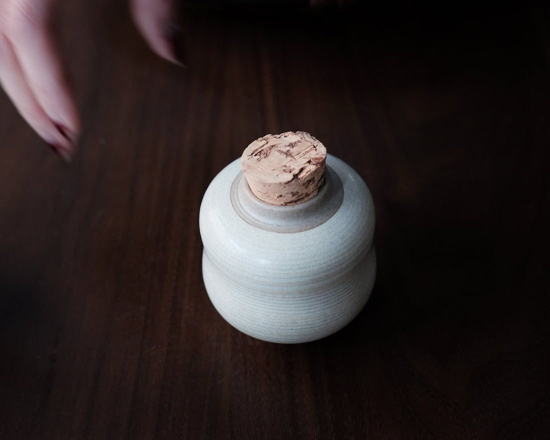 ceramic tea jar with pu'er shupu dark and fermented Chinese tea from Yunnan