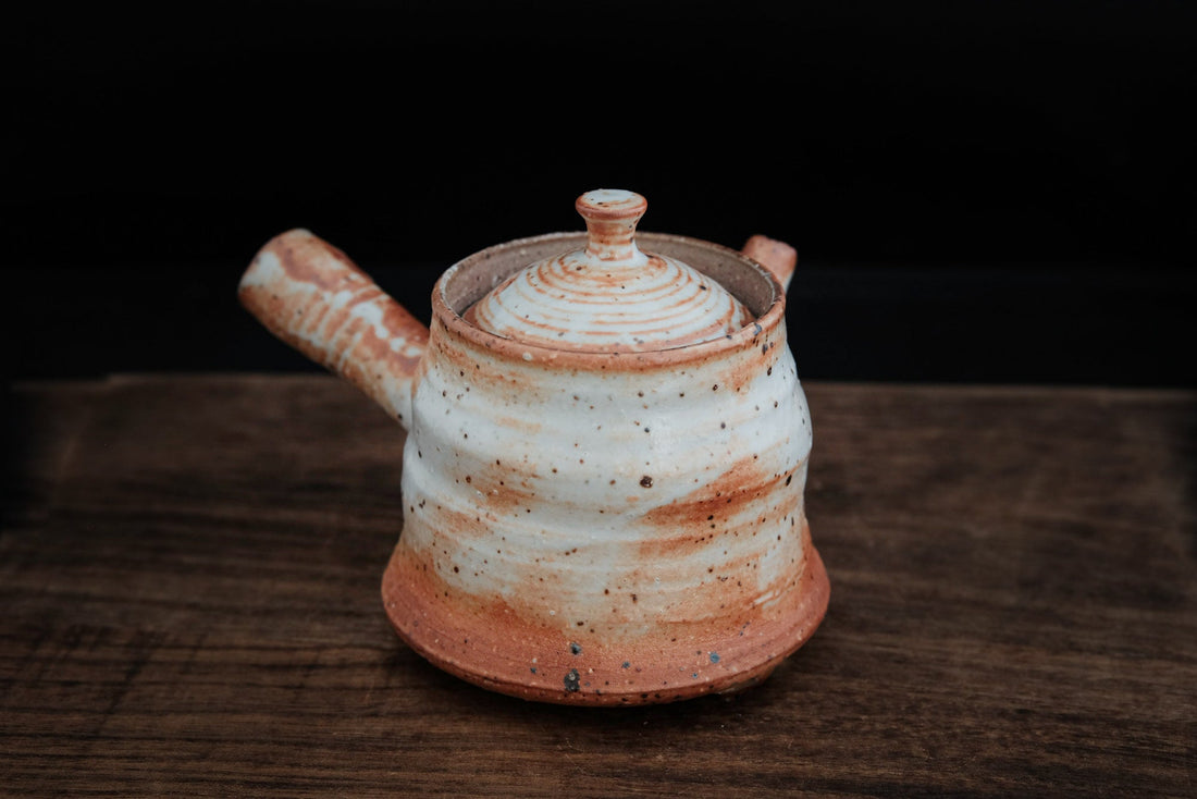 https://easternleaves.com/cdn/shop/products/sacred-fire-180-ml-side-handled-dai-teapot-903211_1100x.jpg?v=1697356912